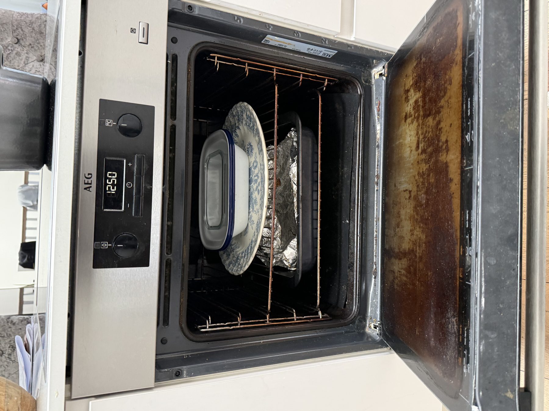 Before: oven in need of deep cleaning